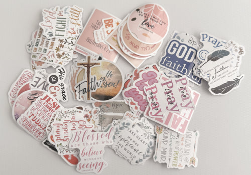 Collection of biblical and inspirational stickers on a light gray background